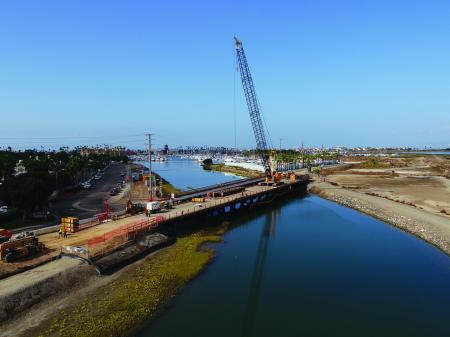 Bridge under construction with crane